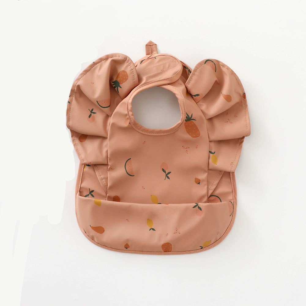 Pink waterproof frilly bib with fruit print