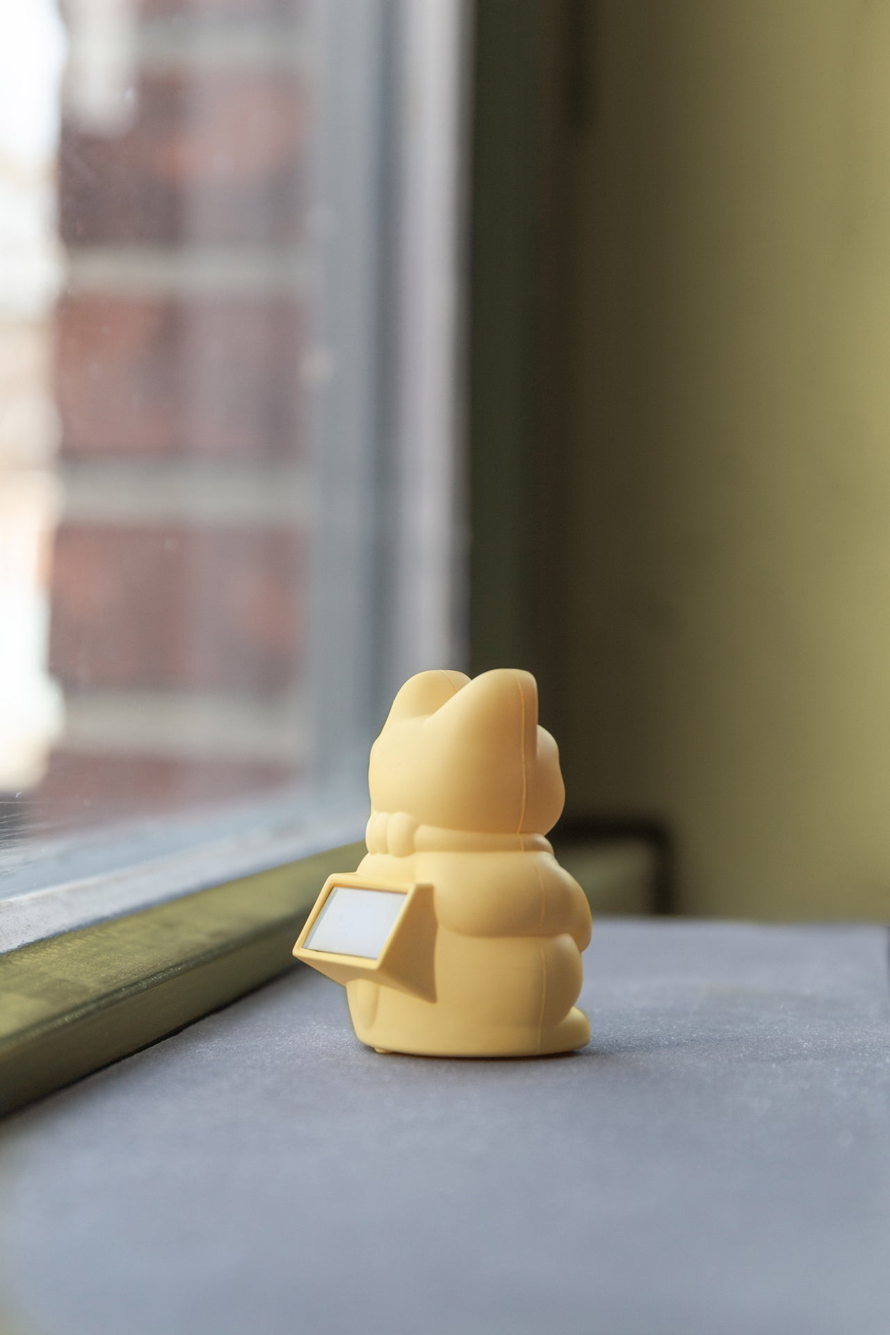 Mini zonnegele gelukskat