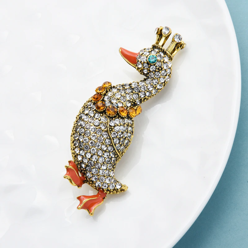 broche canard couronne strass cdb 