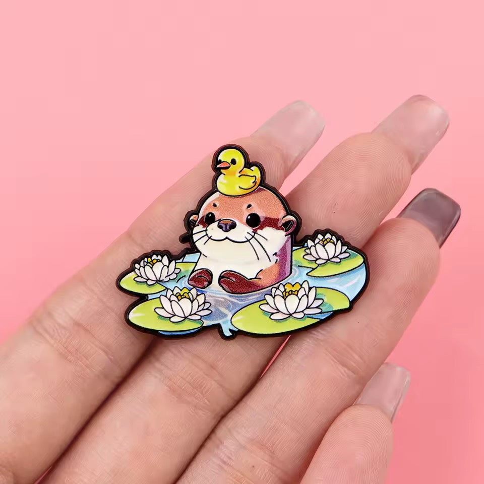 Photo produit - Pin’s Loutre et Caneton sur Nénuphars